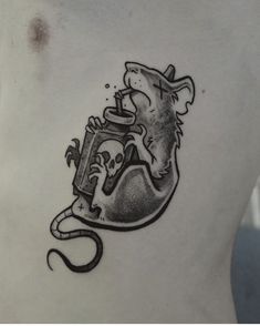 a man's chest with a tattoo on it that has a mouse in the jar