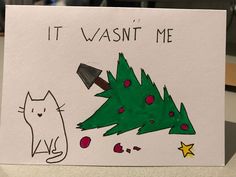 a card with a drawing of a christmas tree and a cat sitting next to it