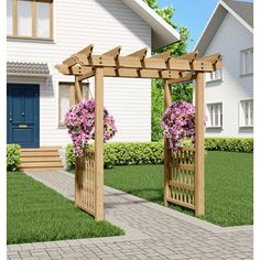 a wooden arbor with flowers on it in front of a house