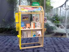 a book stand with books and magazines on it