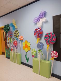 candy lollipops are lined up on the wall