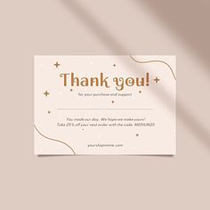 a thank card with gold stars and confetti in the corner on a beige background