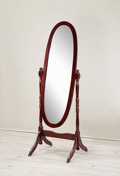 Beautiful cherry cheval- style mirror for traditional decor, tilts for full-body reflection.
Elongated oval glass mirror with wood frame and stand.
Freestanding design swings mirror between stylish turned posts and curved bracketed feet; stretcher for stability between legs.
Dimension: 22.5W x 16D x 59.25H inches. Antique Floor Mirror, Decorating Mirror Frames, Home Gym Mirrors, Gym Mirrors, Wooden Bedroom, Leaner Mirror, Wood Bedroom, Standing Mirror