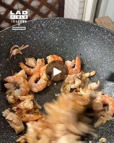 shrimp being cooked in a frying pan on the stove