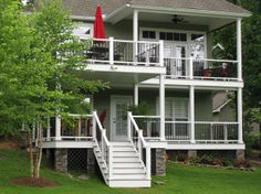 a white house with stairs leading up to it