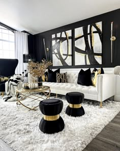 a black and white living room with gold accents