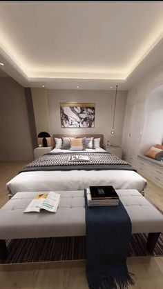 a bedroom with a large bed and white furniture