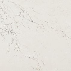 a white marble counter top with cracks in it