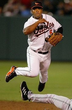 a baseball player is running to catch the ball