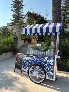 an ice cream cart with blue and white designs