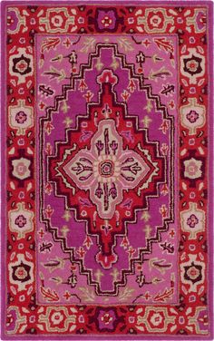 a pink and red rug with an intricate design