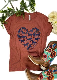 Clay Horse Heart Short Sleeve Tee in navy ink, in the center of the tee, laid flat on white surface with green and white floral décor and boots Clay Horse, Cricut Baby, Horse Heart, Outfit Styles, Country Clothing, Horse Shirt, Horse T Shirts, Teal Turquoise, Cute Messages