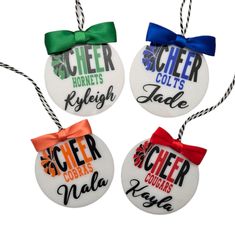 four glass ornaments with bows on them that say cheer, horsch, high school