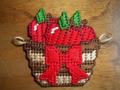 a red strawberry with green leaves in a basket