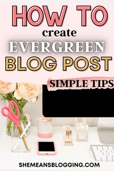 a white desk topped with pink flowers next to a computer