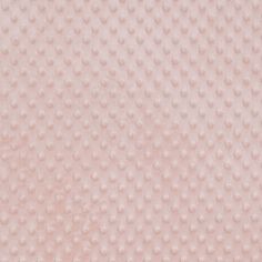 a close up view of a pink background with lots of small white dots on it