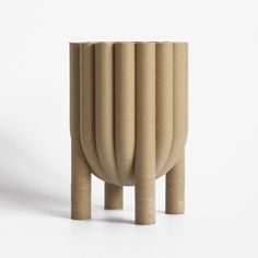 a small wooden vase sitting on top of a table