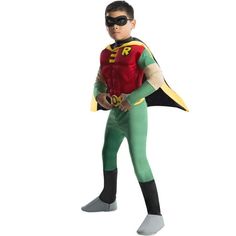 a young boy dressed in a green and red costume