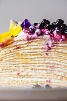 a pancake with blueberries and flowers on top