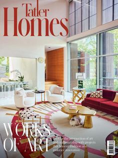 a living room filled with lots of furniture next to large windows on top of a white floor