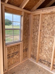 the inside of an unfinished room with wood framing