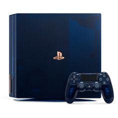 the playstation 4 console is shown next to it's case and controller, which are both dark blue