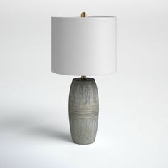 a table lamp with a white shade on it