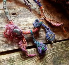 Gorgeous Unique Piece ~ A One Of A Kind Flower Necklace ~ You will get the same necklace as the pictures This one fastens with a natural woodland button. Each one is uniquely handmade from beautiful silks and wools, with gorgeous textures and crocheted details. * Our Patreon crafts community - https://www.patreon.com/LeaandElfie    With different tiers of lovely options to choose from, crafts community, projectalongs, craftalongs, goodie bags/boxes, postcards,     amongst other things. * Instagram: https://www.instagram.com/lea_and_elfie/ * Our Patreon crafts community: https://www.patreon.com/LeaandElfie * Youtube: https://www.youtube.com/@LeaWildCreative * Find Lea's page on facebook here: https://www.facebook.com/leawilliamsartstudio/ * www.littlepentre.co.uk For more fiber art and craf Bohemian Crochet Necklaces For Festivals, Bohemian Crochet Necklace For Festivals, Purple Bohemian Crochet Jewelry, Dread Accessories, Fiber Art Jewelry, Wool Crochet, Creative Textiles, Fairy Jewelry, Felt Jewelry