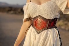 Norse Princess leather belt ~ This belt features an Aegishjalmur (Helm of Awe). It is a symbol of protection and victory. ~ The belt is completely hand-made and hand-tooled. Made from thick quality leather, which will last you a lifetime! sizing: 65cm - fits 65 to 75 cm waist 75cm - fits 75 to 85 cm waist 85cm - fits 85 to 95 cm waist ~ If you wish to have this belt in a different colour, size or other variation, feel free to message me I'll be happy to accommodate your wishes! Fantasy Belt, Belt Corset, Viking Belt, Leather Corset Belt, Symbole Protection, Corset Belt, Viking Style, Leather Corset, Waist Cincher