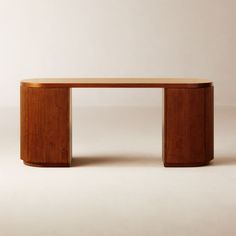 a wooden table sitting on top of a white floor