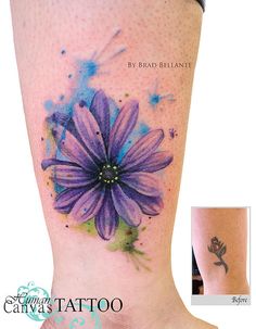 the foot tattoo is decorated with purple flowers and blue watercolors on it's side