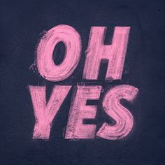 the word oh yes written in pink chalk on a black surface with white writing underneath it