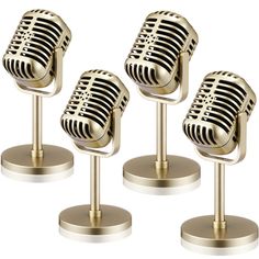 three gold microphones on pedestals with white background