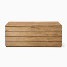 a wooden box sitting on top of a white surface