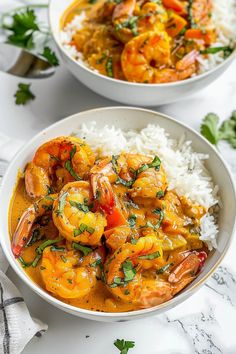 two white bowls filled with shrimp and rice