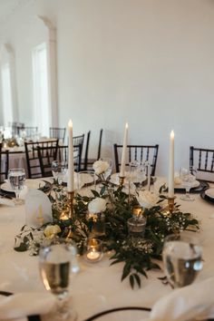 Wedding Table Black Candle Holder, Bud Vases With Greenery On Table, Candlestick And Greenery Centerpiece, Candle Only Table Decor Wedding, Wedding Centerpiece Candlestick, Gold Candle Stick Centerpieces, Brass Candlesticks Wedding Round Table, Wedding Gold Candlesticks, Bud Vases Wedding Centerpiece Winter