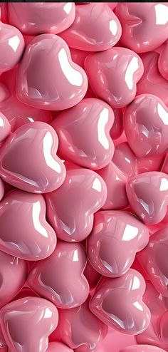 many pink hearts are stacked together in the shape of heart shaped shapes, as if for valentine's day or other special occasion