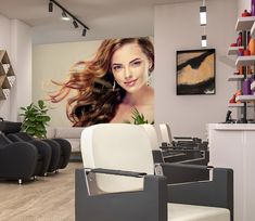 a hair salon with chairs and pictures on the wall