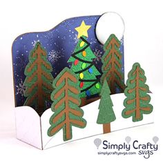 a christmas card with trees on it and the moon in the sky above them is an ornament that says simply crafty