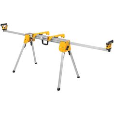 two yellow and black tools sitting on top of each other in front of a white background