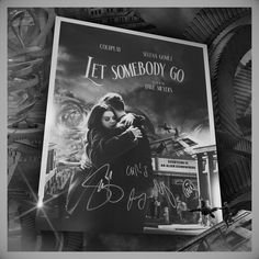 the movie poster for let somebody go has been signed by two people in black and white