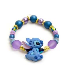 a bracelet with an elephant on it and beads around the bead, which is attached to