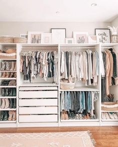 a white closet filled with lots of clothes