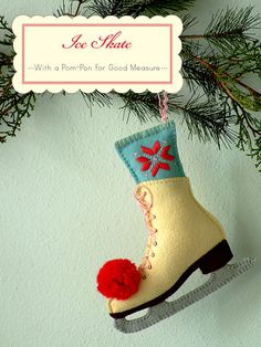 an ornament hanging from a christmas tree with a pair of boots on it