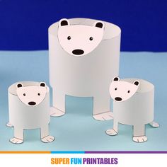 three paper polar bears standing next to each other on a blue background with the words super fun printables