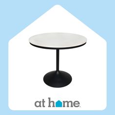 a white table with a black base and the words at home on it's side