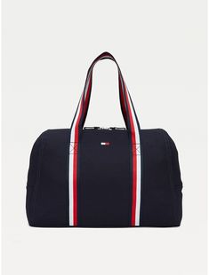 Tommy Hilfiger women's bag. Practicality and standout style come together in this spacious zip tote, showcasing our signature stripes at the handles for a branded finish.  Material: 100% Cotton. Sporty Canvas Bag With Zipper Closure, Sporty Cotton Bags For Daily Use, Sporty Canvas Gym Bag, Tommy Hilfiger Travel Bags With Zipper Closure, Navy Sporty Rectangular Bag, Sporty Rectangular Cotton Bag, Navy Rectangular Sporty Bag, Sporty Navy Rectangular Bag, Navy Sporty Bag With Zipper Closure