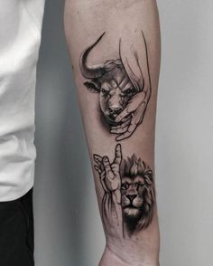 a tattoo on the arm of a man with an animal and hand gesture in front of him