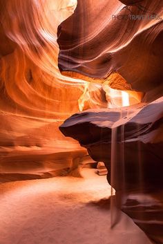 a narrow slot in the side of a canyon with water running down it's sides