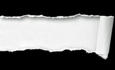 a torn piece of white paper on a black background